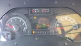 Dashboard of a 2011 Ford Econoline showing speedometer tachometer fuel gauge and odometer with a reading of 153134 km