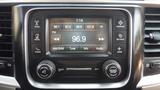 Dashboard of a 2014 RAM 5500 featuring an infotainment system with radio display and control knobs for tuning and volume