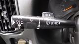 Close-up of the multifunction control stalk in a 2008 Chevrolet C7500 with various symbols for lights wipers and turn signals