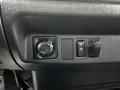 Control panel featuring knobs and switches for a 2020 Hino 338 vehicle