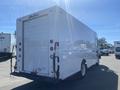 A white 2007 Freightliner MT55 box truck with a rear roll-up door and no visible markings