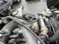 Engine components of a 2008 Hino 268 showing the turbocharger hoses and nearby mechanical elements