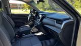 Interior view of a 2018 Chevrolet Tahoe featuring black seats and a modern dashboard with controls and a touchscreen display