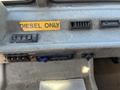 Interior dashboard of a 2010 Freightliner MT45 Garbage Truck featuring control buttons and a sign that reads DIESEL ONLY