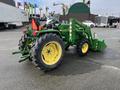 A green 2003 John Deere 790 tractor with a front loader attachment and large rear tires