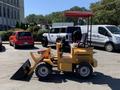 A yellow 2024 Traner TR 45 mini loader with a red canopy bucket shovel and controlled seating positioned for operation