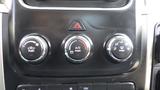 Three control knobs for air conditioning and settings on the dashboard of a 2014 RAM 5500 with labeled functions for air flow and maximum A/C