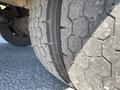 Close-up of a worn tire from a 2006 Workhorse W42 displaying a hexagonal tread pattern with visible signs of use and aging