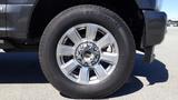 A close-up of a 2017 Ford F-350 SD wheel showcasing a silver alloy rim and a Michelin tire with visible tread pattern