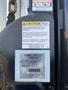 2008 Dodge Ram 5500 with a visible caution label about lubrication and a specs label for a Tommy Lift attached to the side