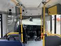 Interior view of a 2017 Chevrolet Express showing driver's seat dashboard and yellow safety bars