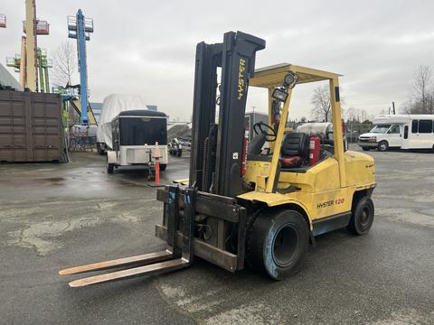 A yellow 2000 Hyster 120 forklift with two long forks positioned at the front