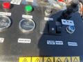 Control panel of a 2024 AGT KTT23 featuring various gauges buttons and switches for operating the machinery