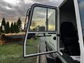 A 2007 Tennant Sentinel with its door open revealing the seat and interior of the vehicle