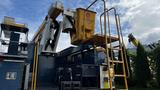 A 2009 International 4300 truck equipped with an articulated aerial lift and a yellow platform marked with an OSI logo