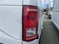 Close-up of the rear tail light of a white 2017 Ford F-150 showcasing its red and clear lenses designed for visibility and safety