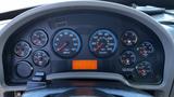 Dashboard of a 2019 International 4300 featuring gauges for RPM speed fuel oil temperature and voltmeter with an orange digital display in the center