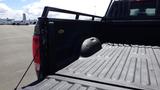 A 2014 RAM 3500 truck bed with a textured surface and a prominent wheel well visible on the left side