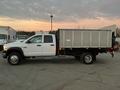 2008 Dodge Ram 5500 white pickup truck with a flatbed and a metal sidewall cargo box