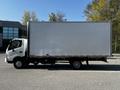 A 2020 Hino 195 box truck with a white cargo area and a cab painted in light colors parked on a paved surface