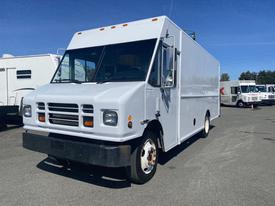 A 2007 Freightliner MT55 delivery truck with a white body and large front windshield featuring multiple headlights and a flat front design