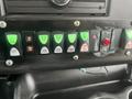 Control panel with various switches and buttons in a 2017 Chevrolet Express including light controls and electrical functions