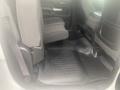 Interior of a 2015 Chevrolet Silverado 3500HD showing rear seats and floor mats