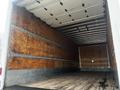 Interior of a 2020 Hino 338 truck with a wooden floor and wooden paneled walls