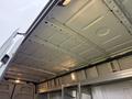 Interior view of a 2019 Mercedes-Benz Sprinter cargo van showing a bare metal ceiling with built-in lights and no insulation or cover