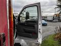 The image shows the open driver's side door of a 2008 Ford F-750 with a black interior and controls visible inside