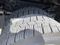 Close-up of a heavily treaded tire from a 2010 Ford F-550 showing wear and texture on the rubber surface