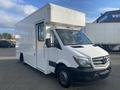 A 2017 Mercedes-Benz Sprinter van with a white exterior and a boxy shape designed for cargo transport