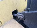 Close-up of a 2000 Hyster 120 forklift's hydraulic connection showing metal components and bolts