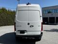 A white 2022 Mercedes-Benz Sprinter van viewed from the rear with a smooth surface and the brand logo visible on the back door