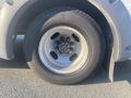 The image shows a close-up of a tire mounted on a gray rim from a 2017 Chevrolet Express