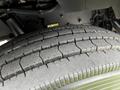 Close-up of a tire from a 2014 Kenworth T370 showing tread patterns and rubber texture