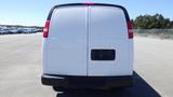 White 2012 GMC Savana van viewed from the rear with no visible license plate and simple taillights