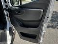 The image shows the interior door panel of a 2022 Mercedes-Benz Sprinter with a sleek design featuring a handle and a storage compartment