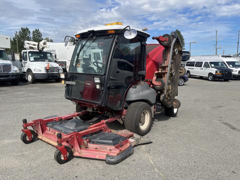 A 2014 Toro Groundmaster 5910 with a black and red body featuring a large cutting deck and two front-mounted mowers designed for turf maintenance