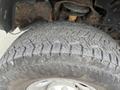 Close-up of a tire from a 2010 Dodge Ram showing tread patterns and details on the rubber surface