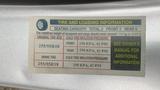 Tire and loading information label for a 2013 Lincoln MKT detailing seating capacity tire sizes and inflation pressures