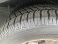 Close-up of a tire on a 2017 Chevrolet Express showing detailed tread pattern and sidewall markings