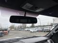 View of the interior of a 2014 Ford F-150 featuring the rearview mirror and overhead console