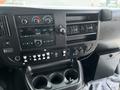 Dashboard of a 2017 Chevrolet Express showing controls for air conditioning audio system and various vehicle functions