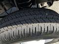 Close-up of a tire tread from a 2019 Ford Econoline showcasing its deep grooves and pattern designed for traction and stability