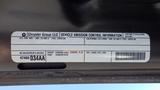 A 2014 RAM 3500 vehicle emissions control information label with details about the engine and fuel type