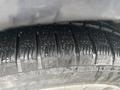 Close-up of a tire tread on a 2014 Subaru Impreza showing detailed patterns and surface texture