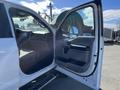 A 2019 Ford F-350 SD with an open driver's side door showcasing the interior and dashboard details