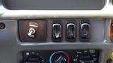 Close-up of the dashboard controls of a 2007 Sterling Acterra L7500 featuring switches for parking brake mirror heat and options with a climate control knob