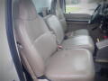 Interior of a 2008 Ford F-550 featuring leather front seats designed for three passengers